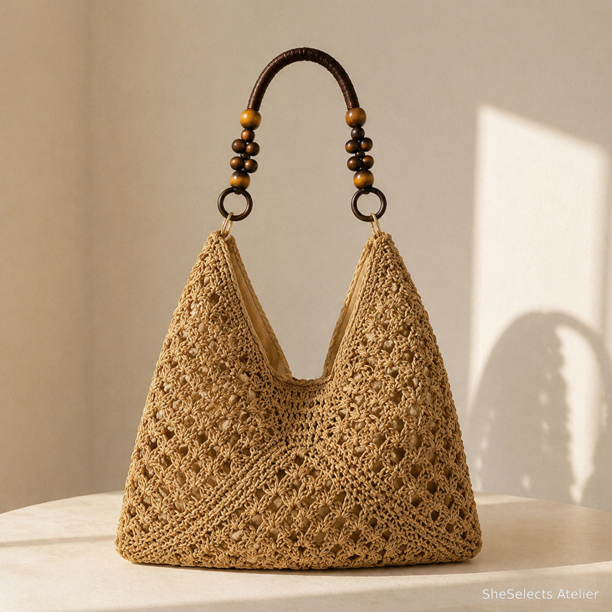 Khaki open-weave beach tote with dark beaded short handle