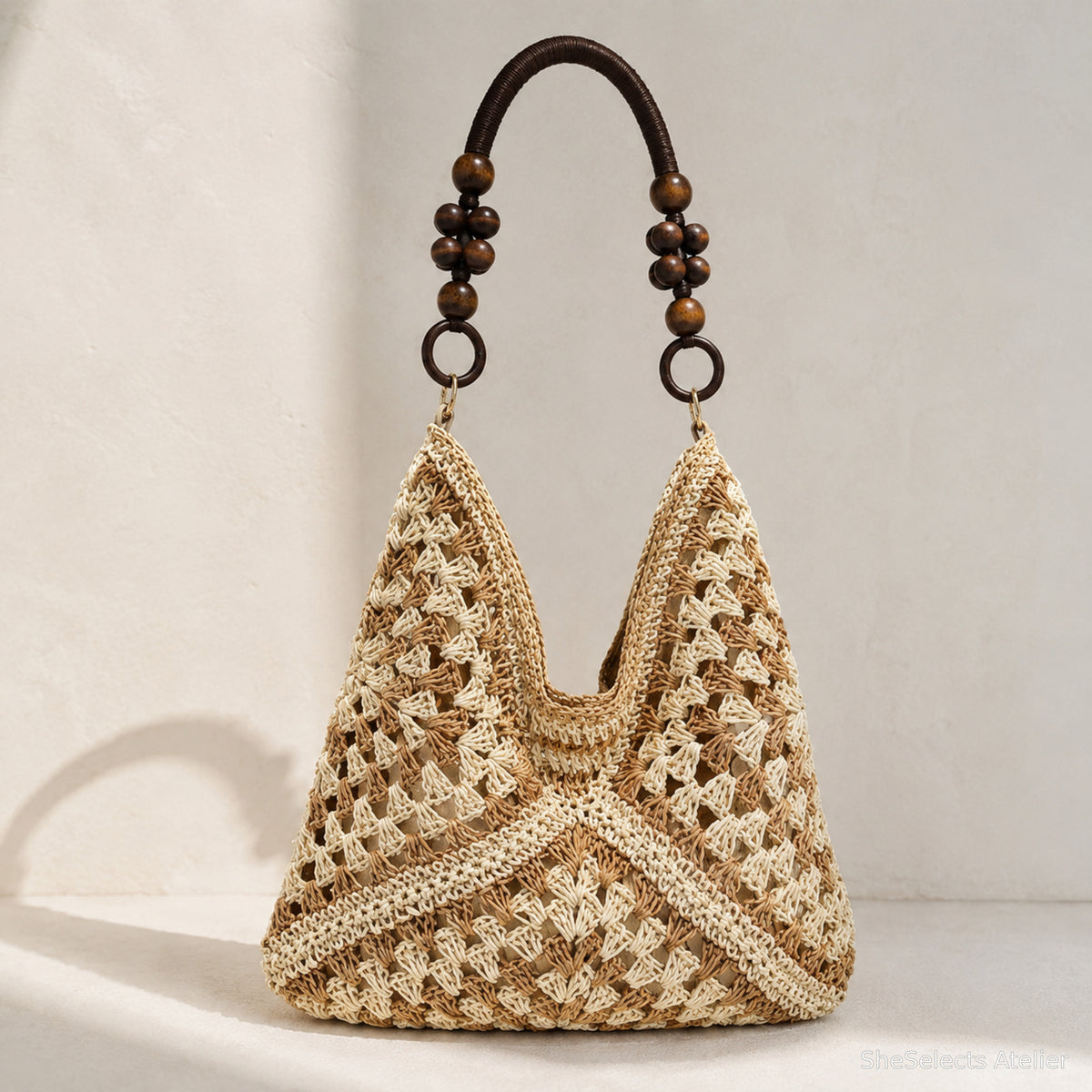 Ivory and khaki woven hobo tote with dark bead handle accents